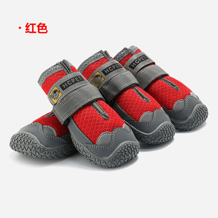 Red and gray pet shoes with visible brand logo on a white background