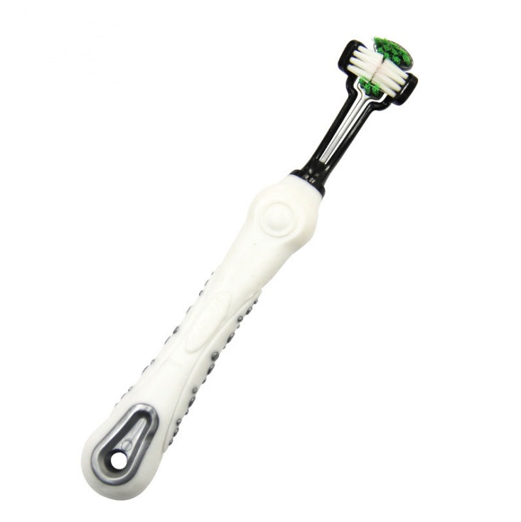 White and black toothbrush with green bristles on a white background
