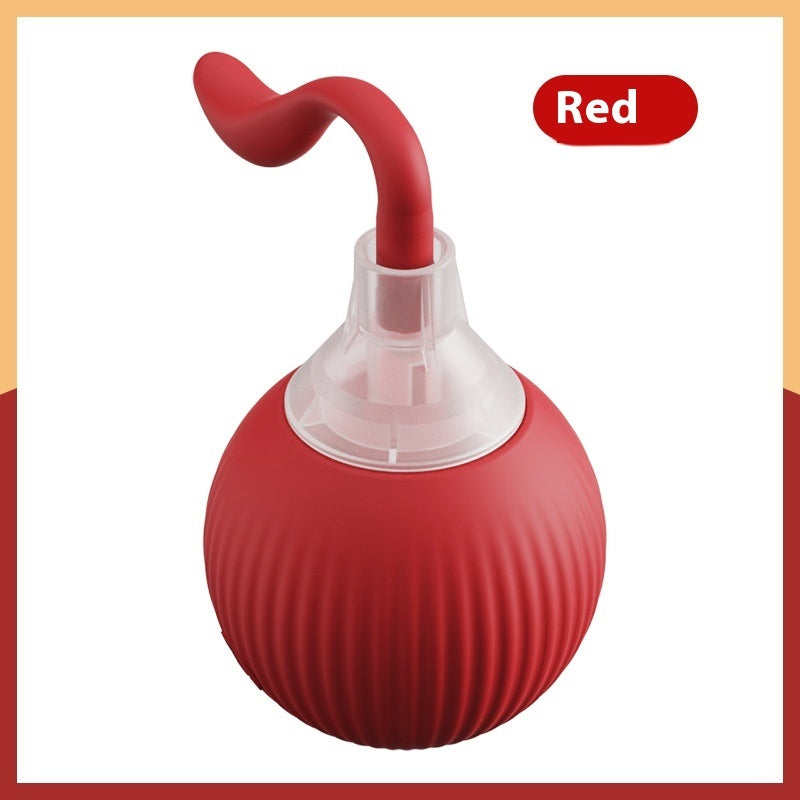 Red bulb syringe with a clear chamber on a white background