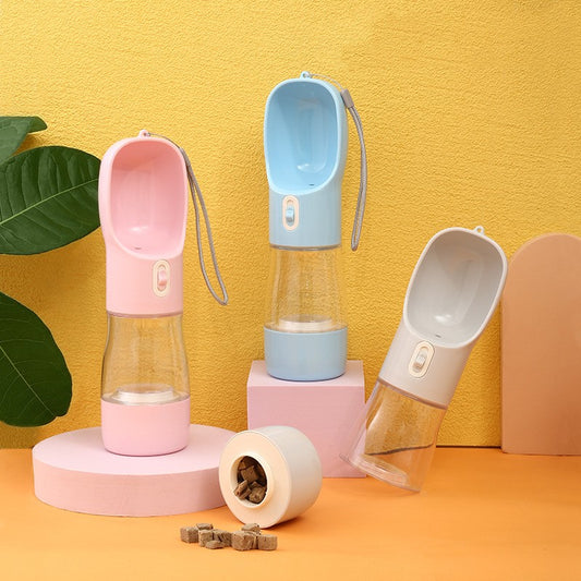 Set of pet water bottles and bowls on a yellow and orange background